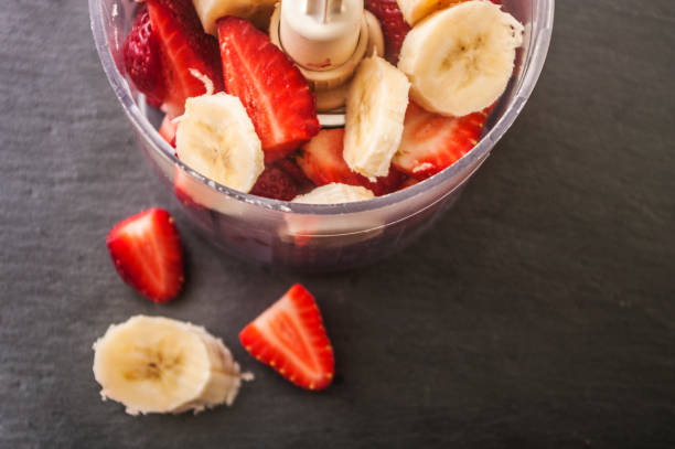 istock strawberry banana fruit in a blender ready to blend 673498522