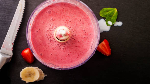 istock Fresh strawberry and banana smoothie 673498536