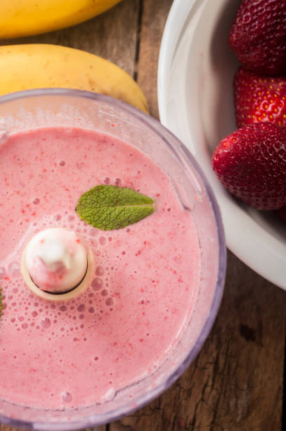 istock Fresh strawberry and banana smoothie 673498550