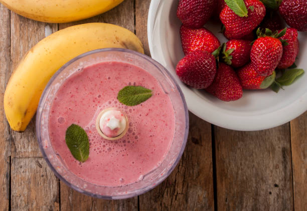 istock Fresh strawberry and banana smoothie 673498566