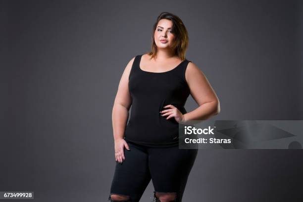 Plus Size Fashion Model In Casual Clothes Fat Woman On Gray Background Overweight Female Body Stock Photo - Download Image Now