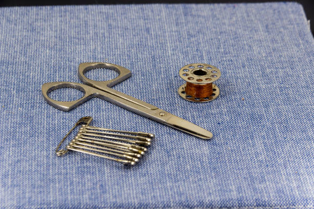 istock Beautifully laid out accessories for needlework on a jeans background 673500246