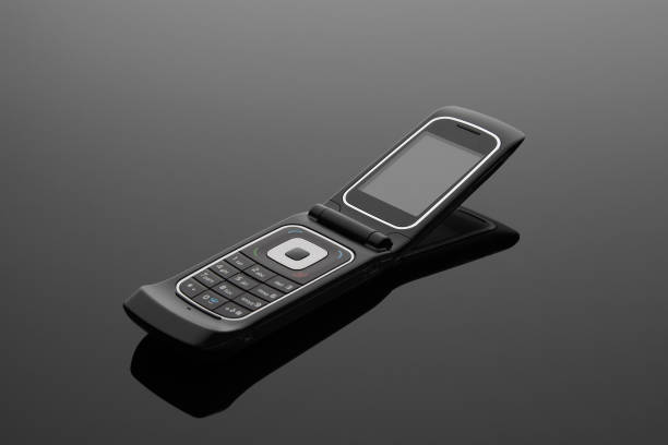 istock The old mobile phone on a grey background. 673506304