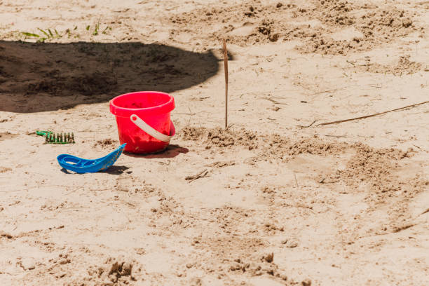 istock Bucket and other sand toys on a beach 673510306