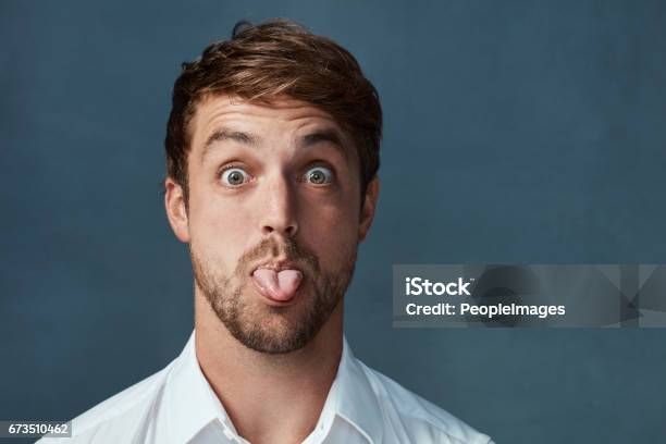 He Can Be A Little Cheeky At Times Stock Photo - Download Image Now - Sticking Out Tongue, Men, Portrait