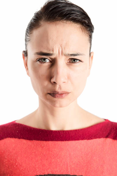 istock A woman looking to camera with frustration and anger 673522202