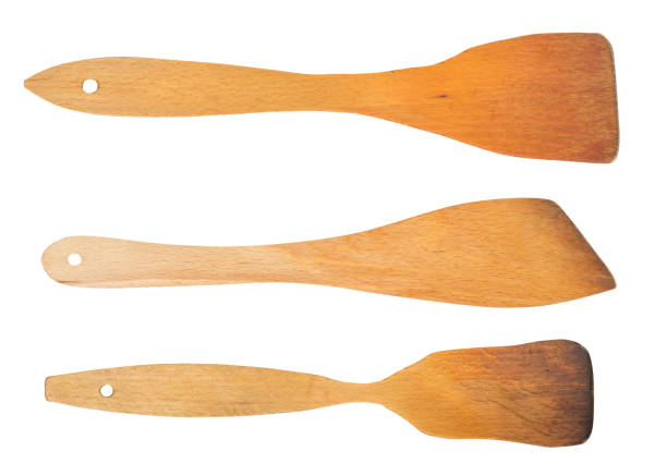 istock Wooden spatula for cooking set isolated on white background 673525074