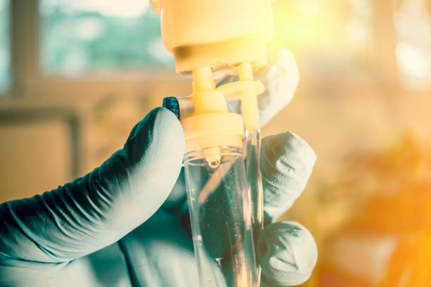 Doctor's gloved hand controlling perfusion offering cancer treatment