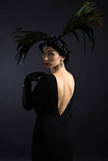 istock beautiful woman in retro style with feather decration 673531476