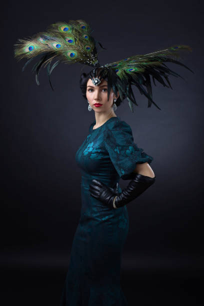 istock beautiful woman in retro style with feather decration 673531480