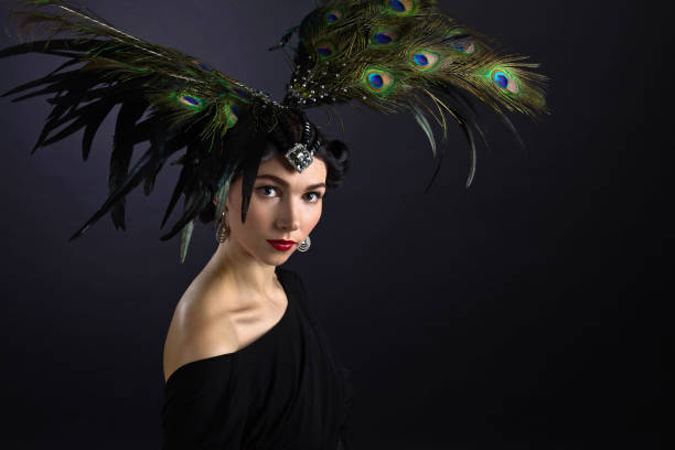 istock beautiful woman in retro style with feather decration 673531482