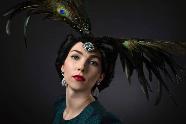 istock beautiful woman in retro style with feather decration 673531486