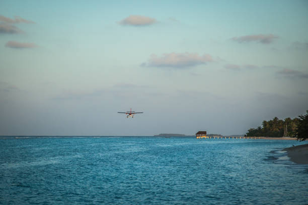 istock Seaplane landing in the ocean lagoon. 673532646