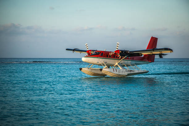 istock Seaplane landing in the ocean lagoon. 673532694