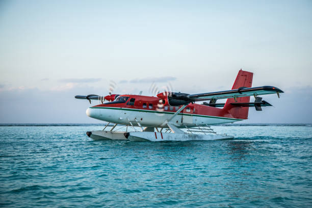 istock Seaplane landing in the ocean lagoon. 673533628