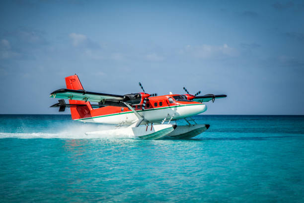 istock Seaplane landing in the ocean lagoon. 673536480