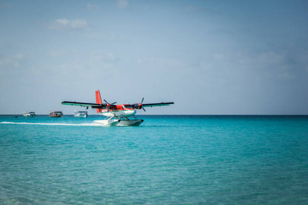 istock Seaplane landing in the ocean lagoon. 673536958