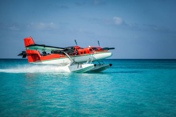 istock Seaplane landing in the ocean lagoon. 673536986