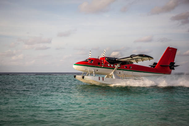 istock Seaplane landing in the ocean lagoon. 673537088