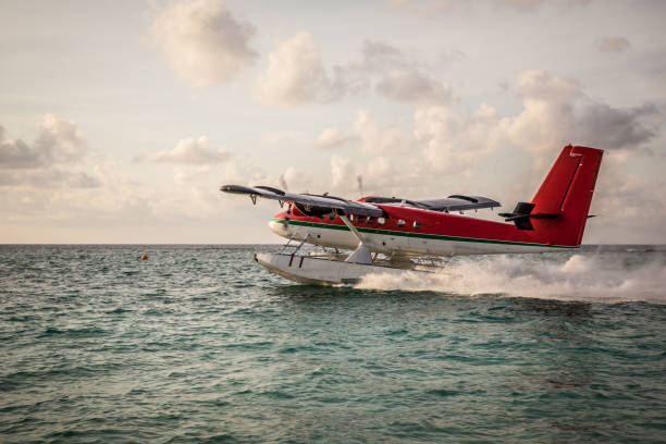 istock Seaplane landing in the ocean lagoon. 673537112