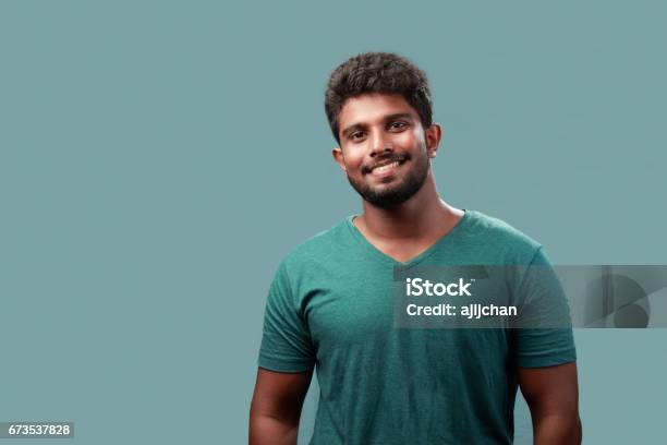 Portrait Of A Young Man Of Indian Origin Stock Photo - Download Image Now - Men, India, Indian Ethnicity