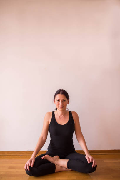 istock Beautiful woman doing Lotus Position 673549750