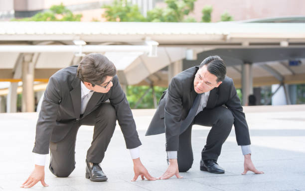 istock businessman getting ready for race competition business rival concept . 673559148