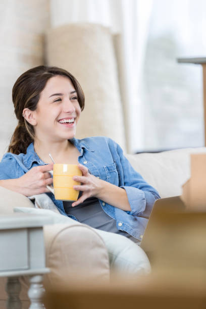 istock Smiling woman relaxes at home 673559994
