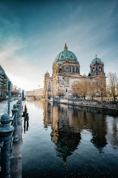 Berlin Cathedral with reflection in river at morning hour berlin, history, architecture, cathedral, river, season, sights, spree river photos stock pictures, royalty-free photos & images