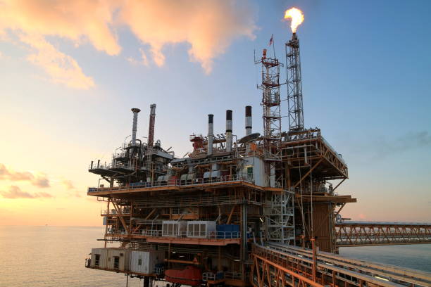 istock Offshore construction platform for production oil and gas with sunset sky 673567004