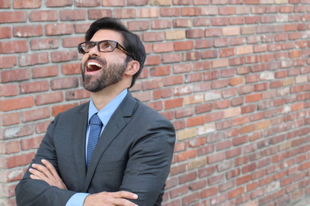 istock Successful excited business man happy looking up 673570984