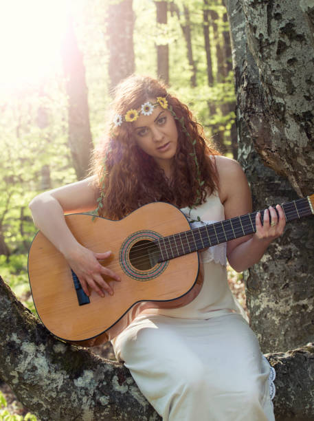 istock Girl  playing guitar 673571606