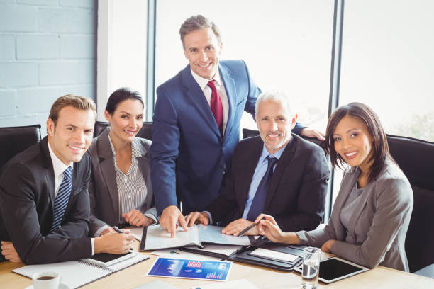 istock Businesspeople in conference room 673573926
