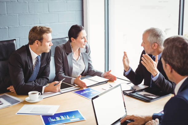 istock Businesspeople in conference room 673574306