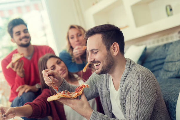 istock Friends having fun at home 673581234