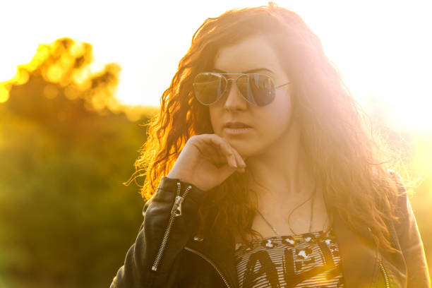 istock Girl enjoying the sunset 673582060