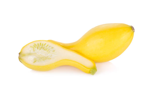 istock whole and half cut fresh squash crookneck on white background 673585384