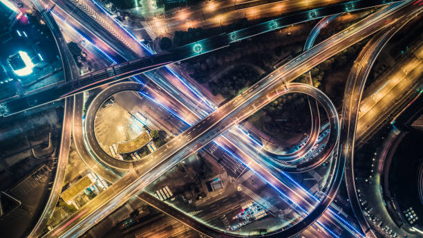 aerial view of highway at night Multiple Lane Highway, Overpass, Elevated Road, Road, Road Intersection night freeway stock pictures, royalty-free photos & images