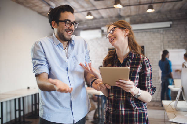 istock Company coworkers working in office and sharing new ideas 673592078