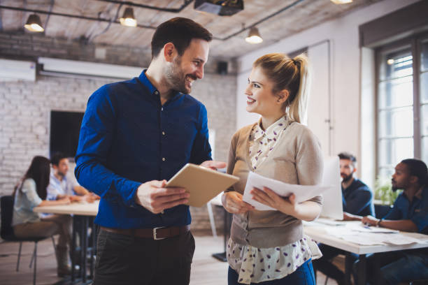 istock Company coworkers working in office and sharing new ideas 673592848