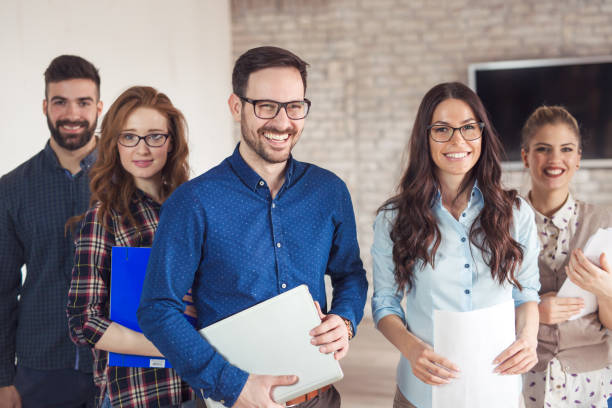 istock Successful company with happy employees in modern office 673593612