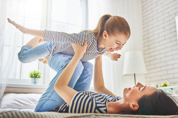 istock Mom and her daughter are playing 673593624