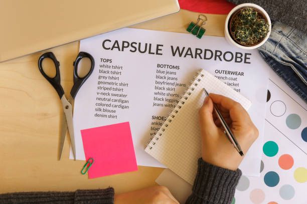Woman creating a capsule wardrobe stock photo