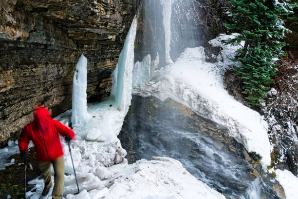 istock Hiking Frozen Waterfalls Melting in Spring 673603246