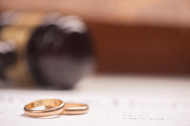 istock Wedding Rings And Wooden Gavel 673603780