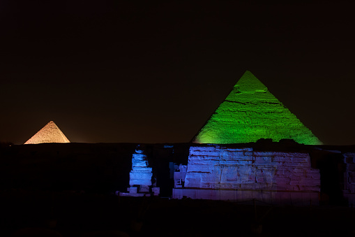 Egyptian pyramids at night with lights
