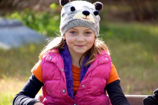 istock Girl smiling playing outdoors in the fall 673617934