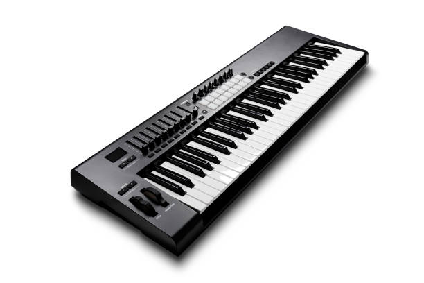 istock Electronic synthesizer piano isolated on white 673618166