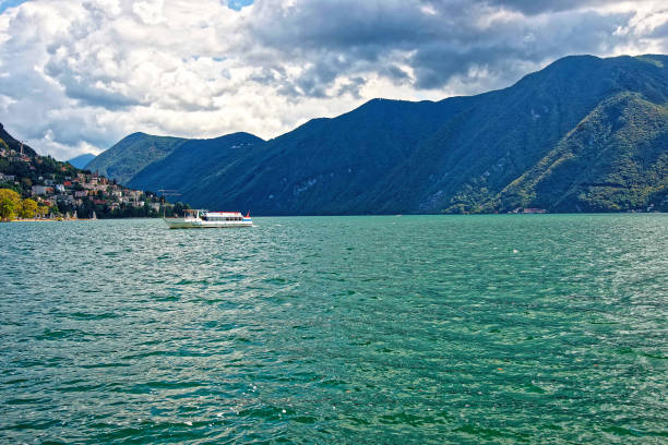 istock Small passenger ship at promenade in Lugano in Ticino Switzerland 673627802