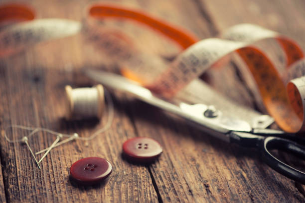 istock Sewing accessories on wooden 673632706